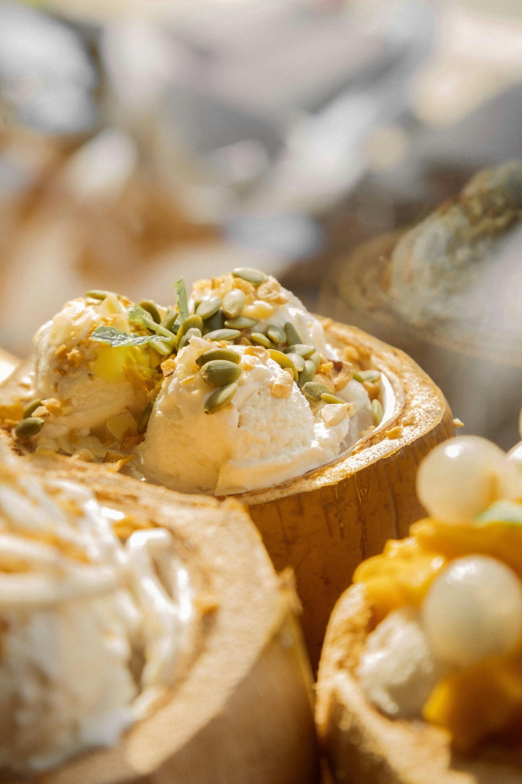 Delicious Vietnamese coconut ice cream topped with seeds and nuts, perfect for a tropical treat.